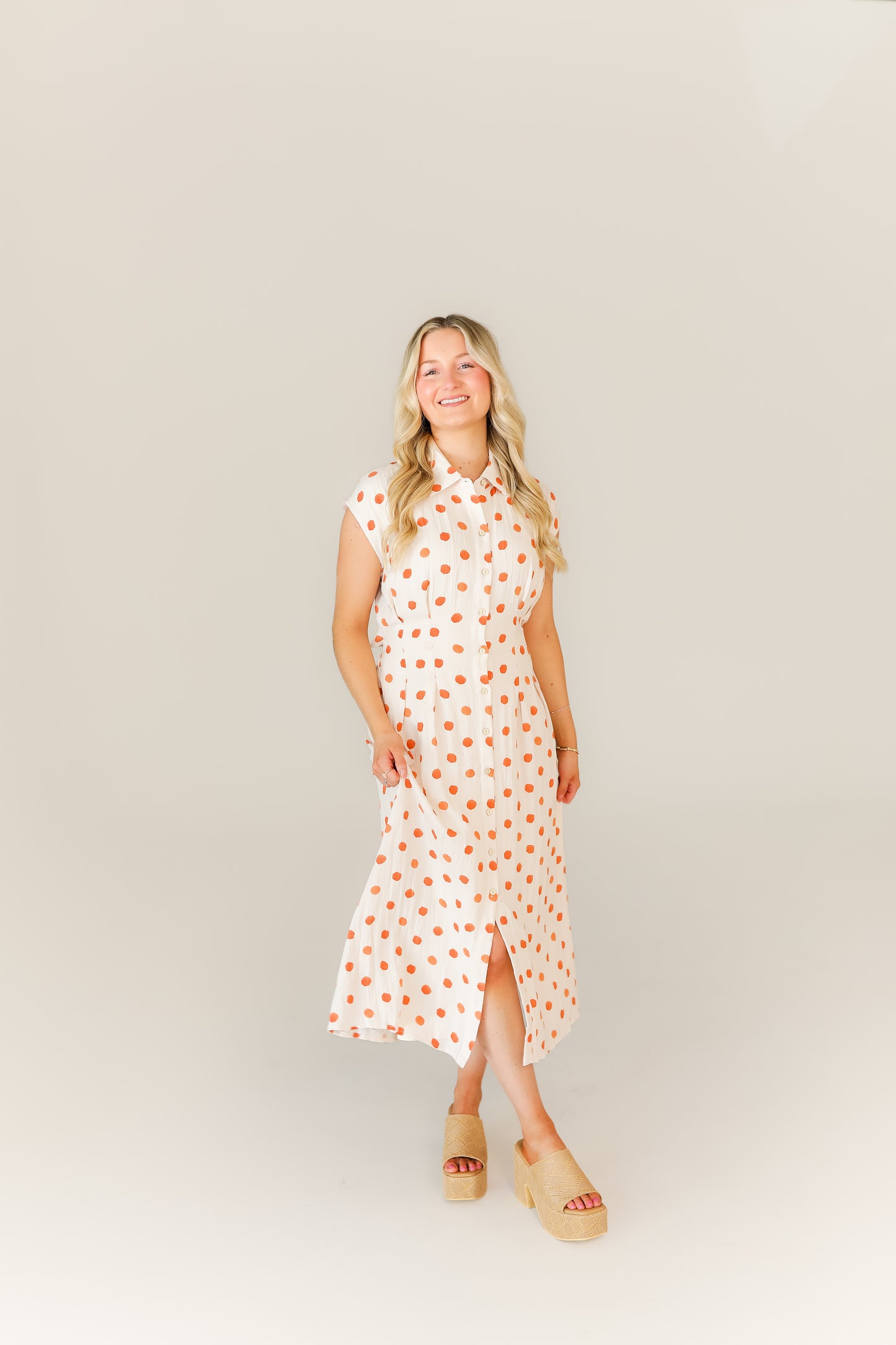 Flowy polka dot midi dress with sleeveless halter neckline