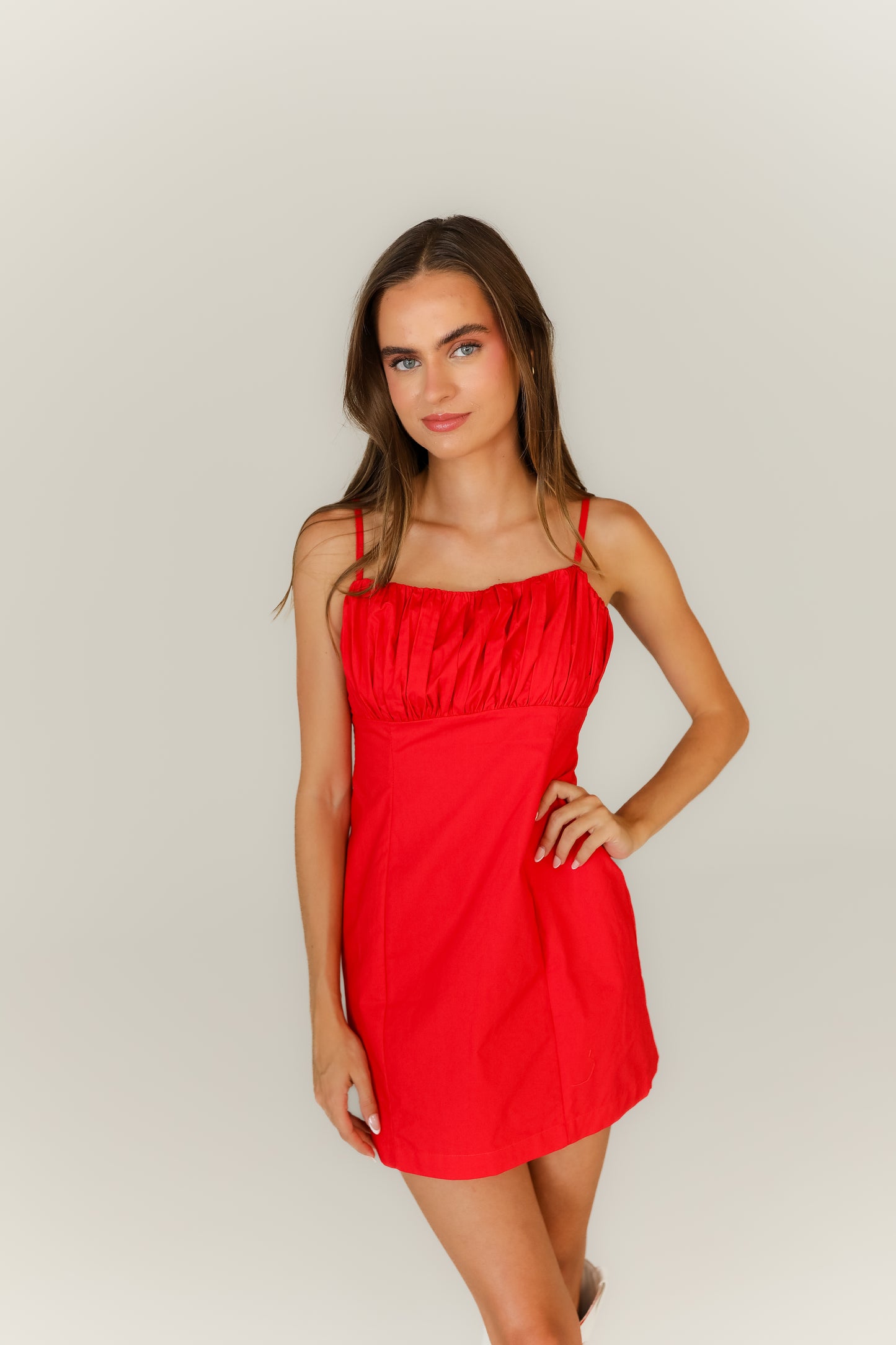 Red strappy mini dress boutique game day outfit with boots
