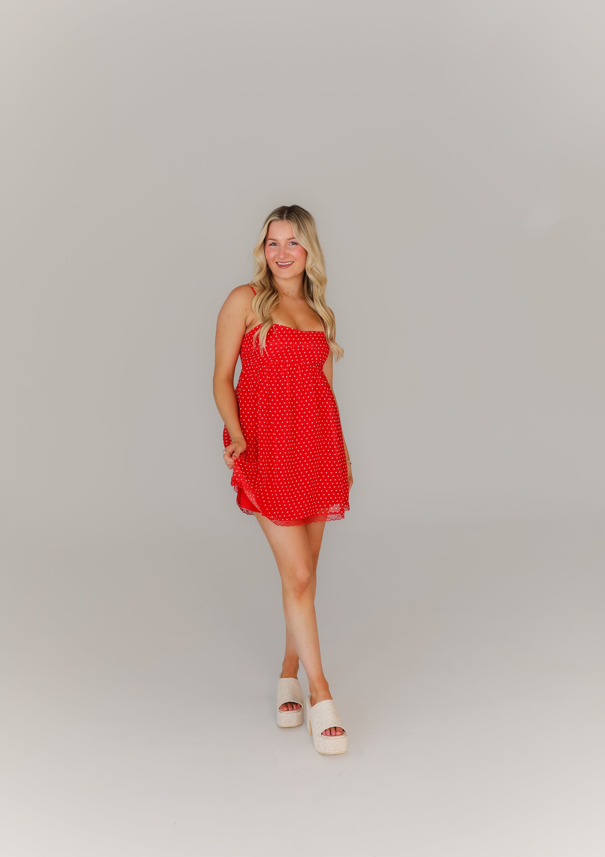 Women’s red polka dot mini dress with thin straps game day look