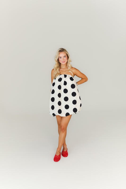 Black and white polka dot mini dress with bubble hem game day outfit