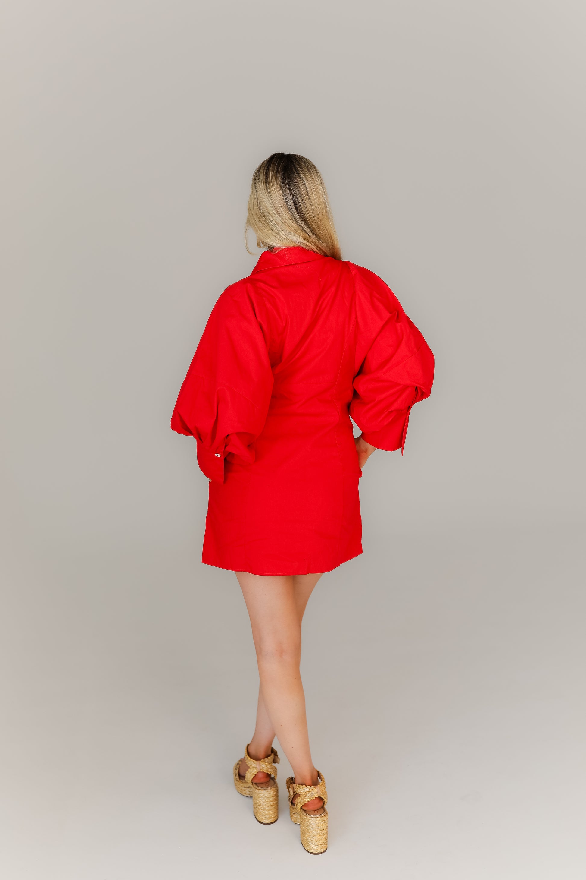 Back of red balloon sleeve mini dress women’s boutique fashion