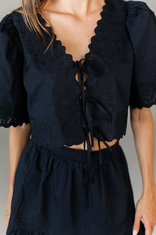 Tie-front navy crop top with eyelet trim boutique style