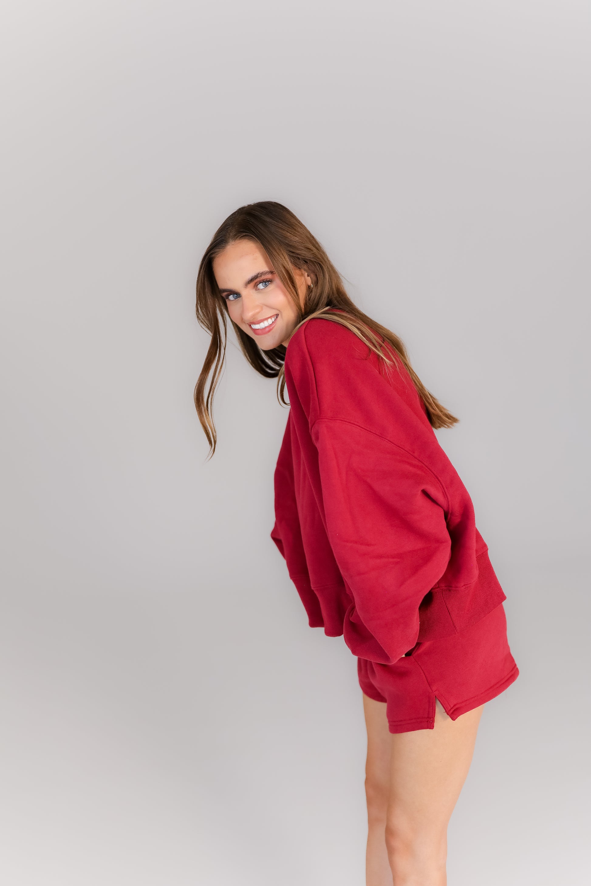 Friends wearing boutique crimson and grey oversized loungewear sets