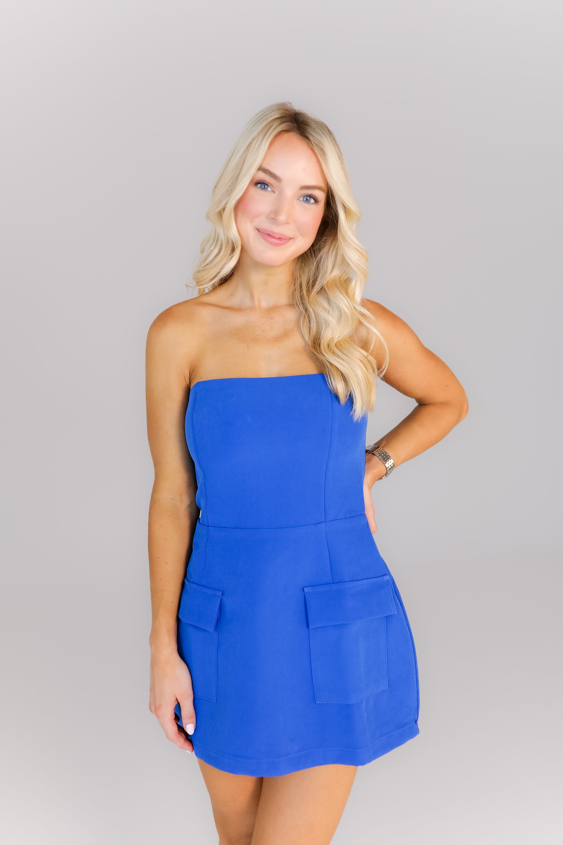 Front view of royal blue strapless mini dress for women