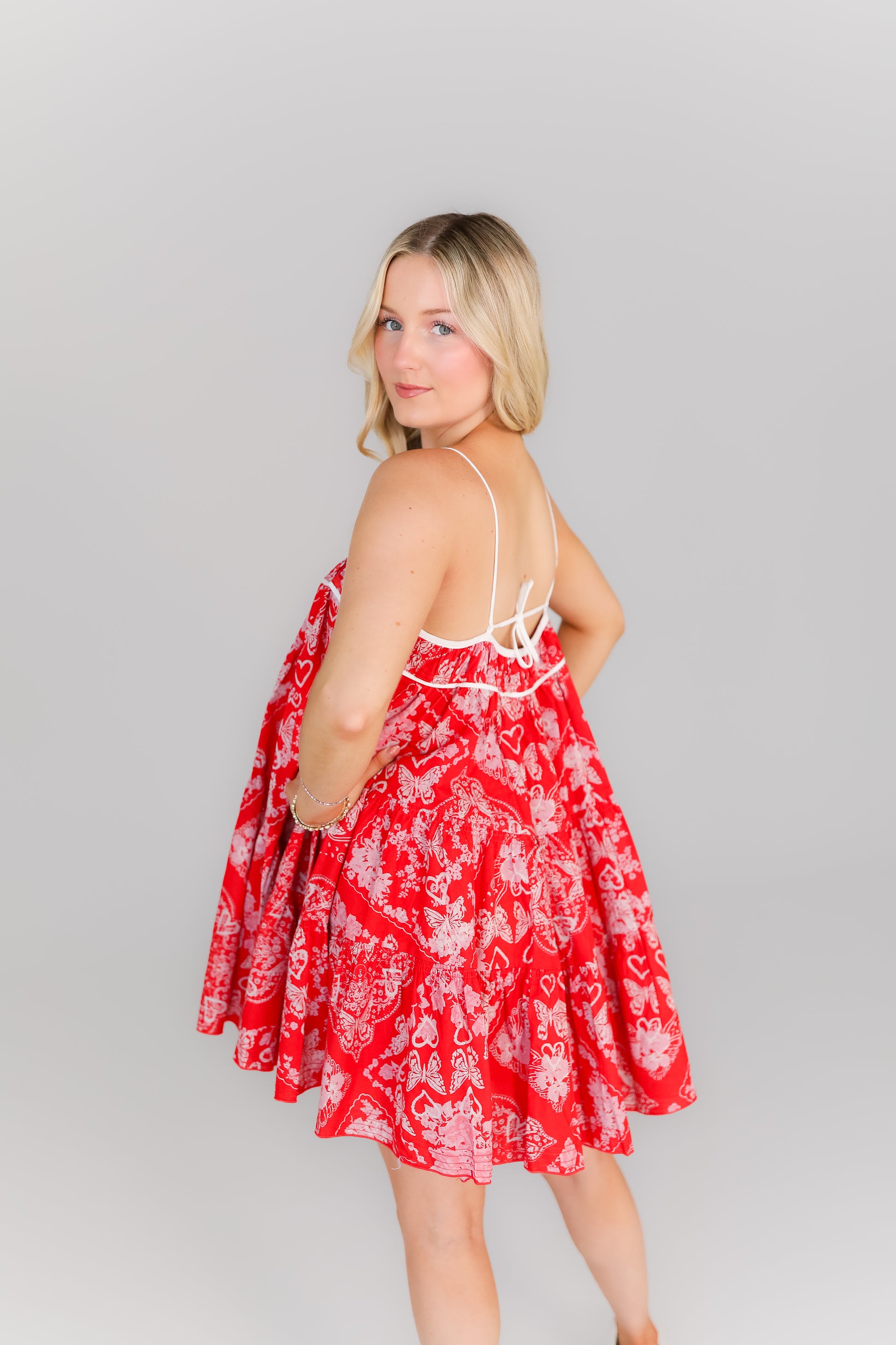 Vibrant red spaghetti strap mini dress with babydoll flared silhouette