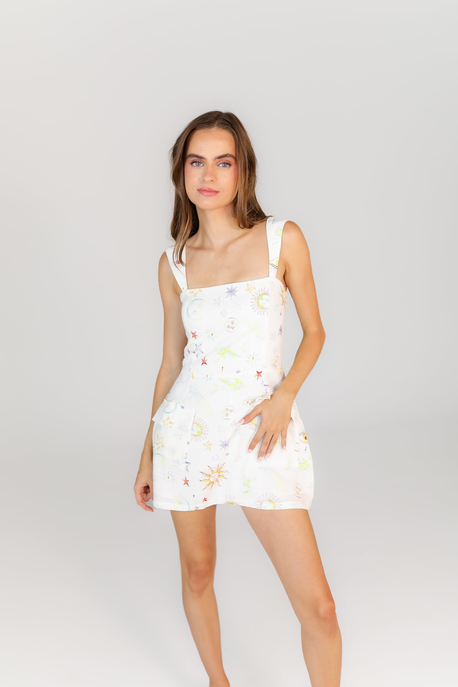 Women’s boutique mini dress with cosmic flower pattern and straps