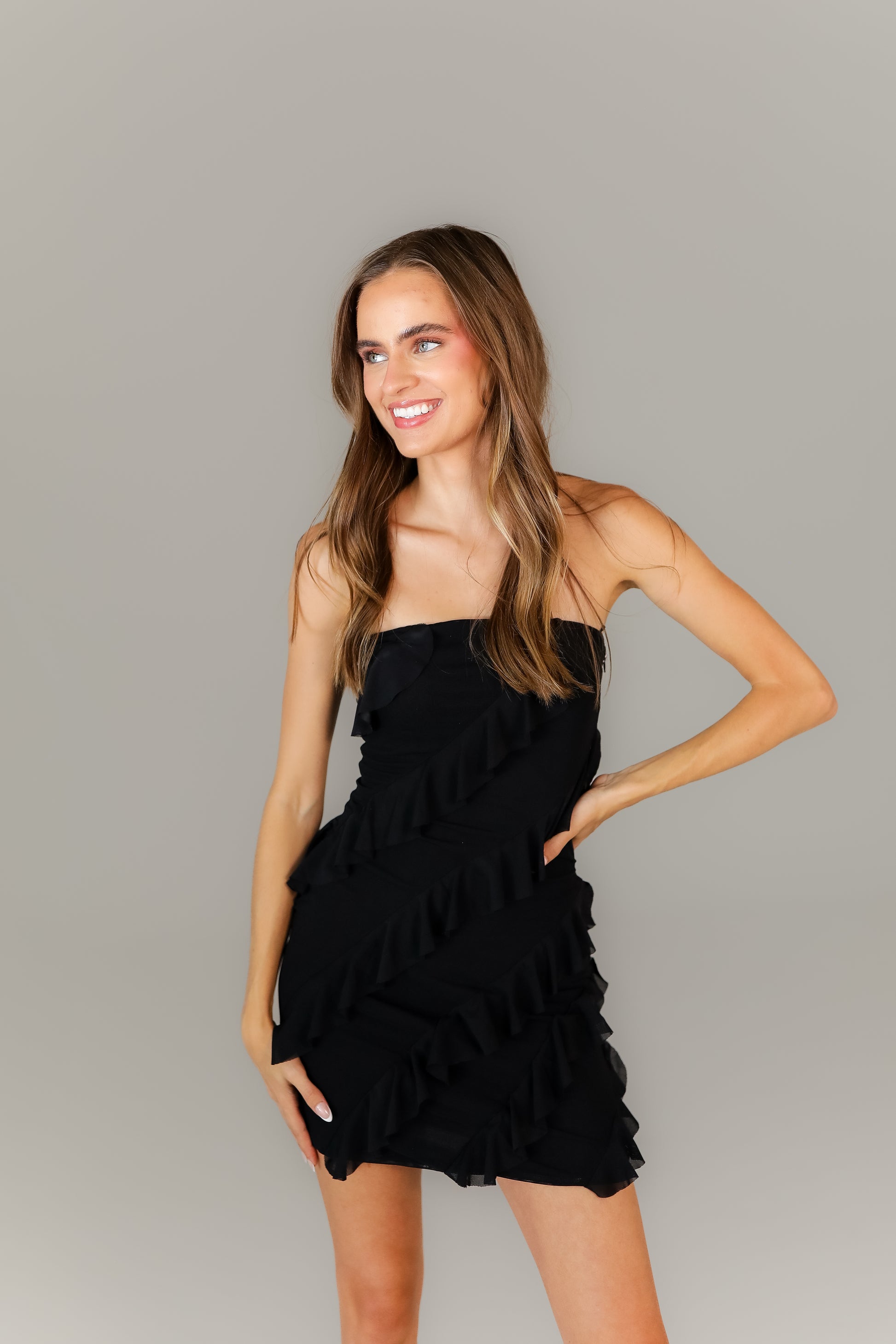 Boutique little black dress with ruffle details for night out