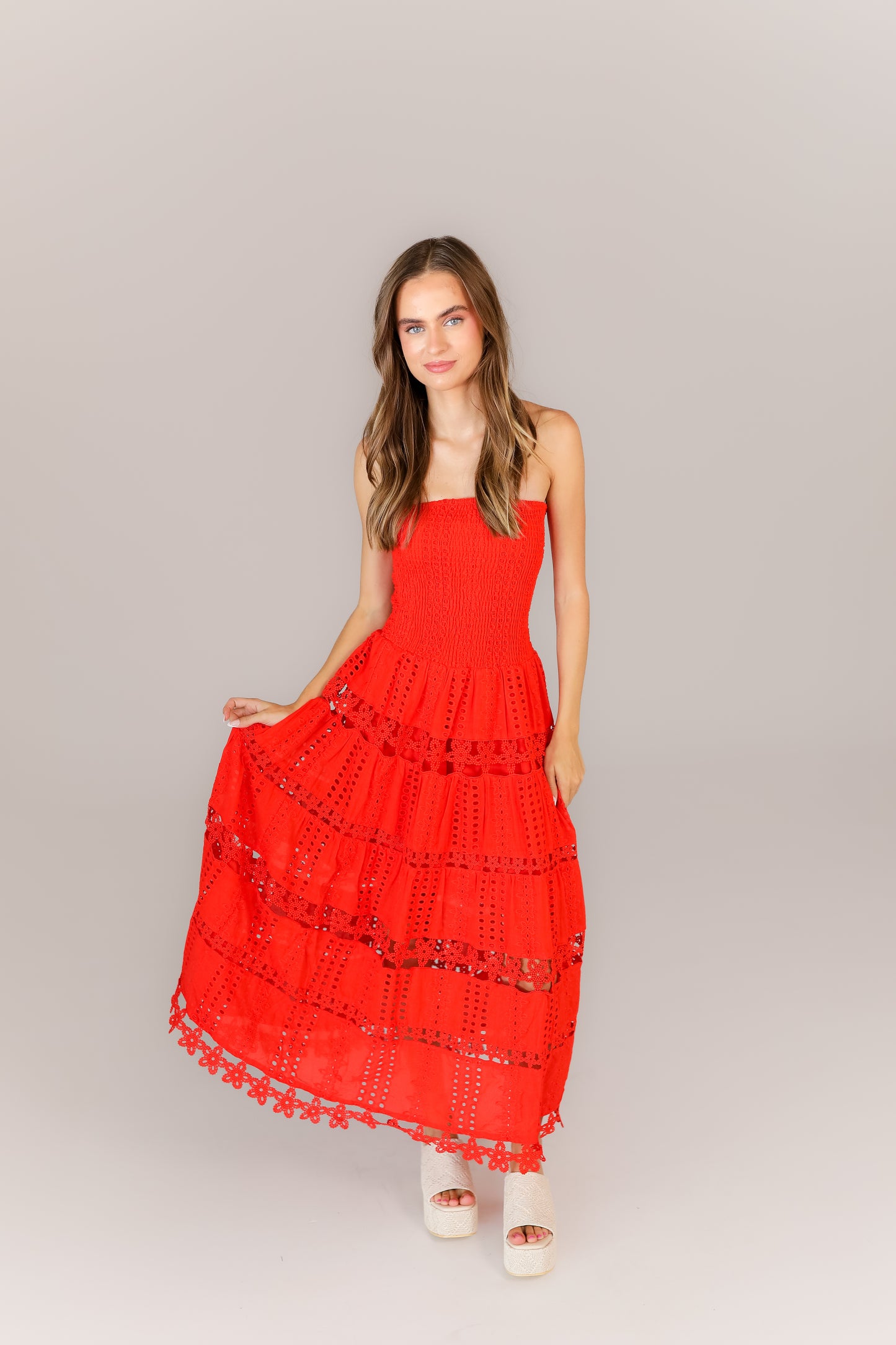 Game day inspired red dress with feminine details and tiered design