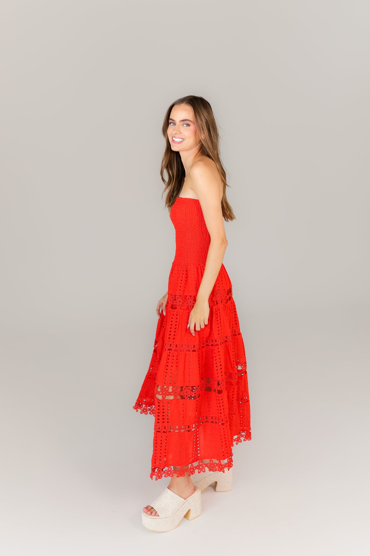 Side view of red boutique midi dress perfect for football season