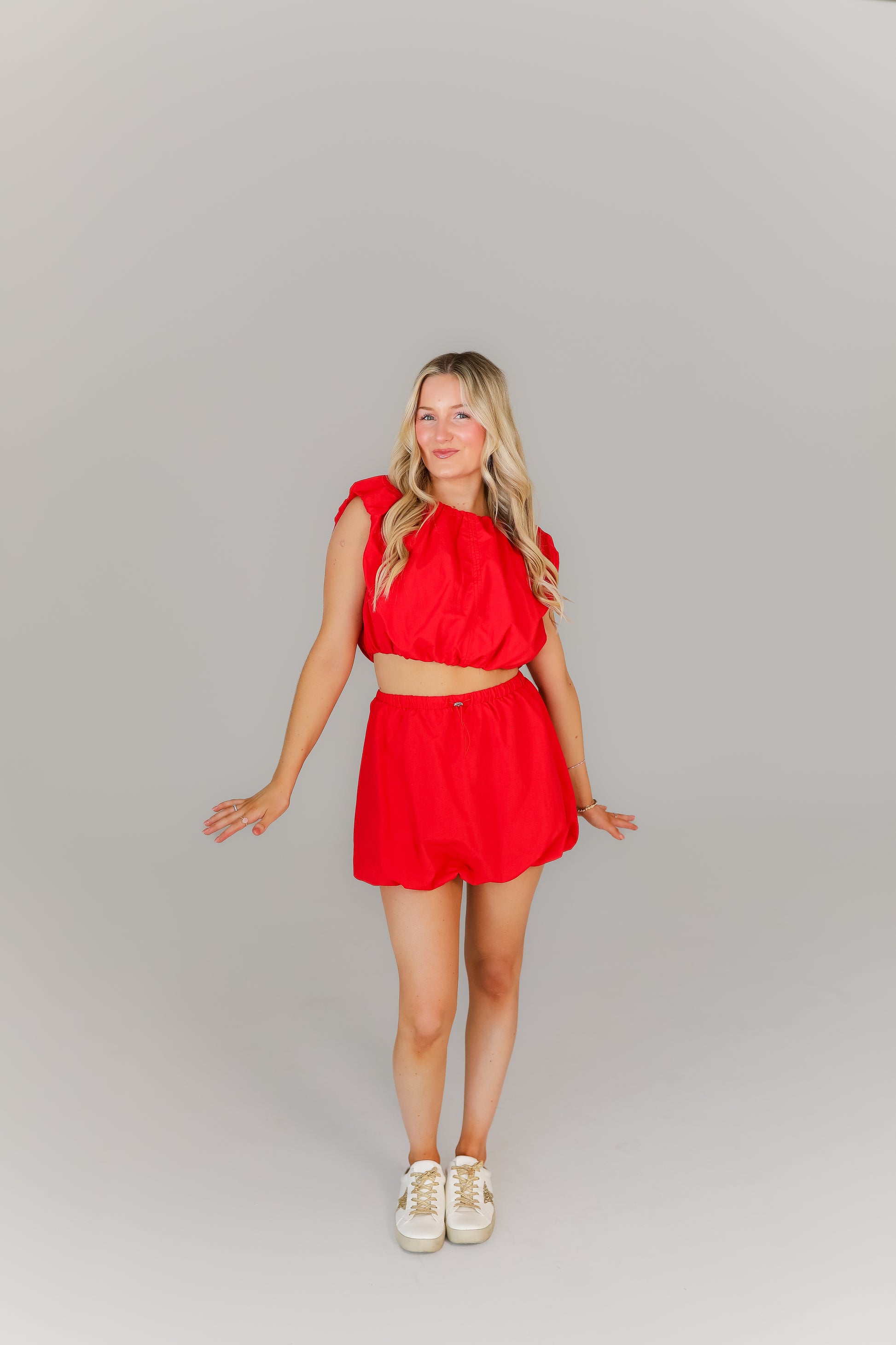 Two-piece red bubble set styled for game day or running errands