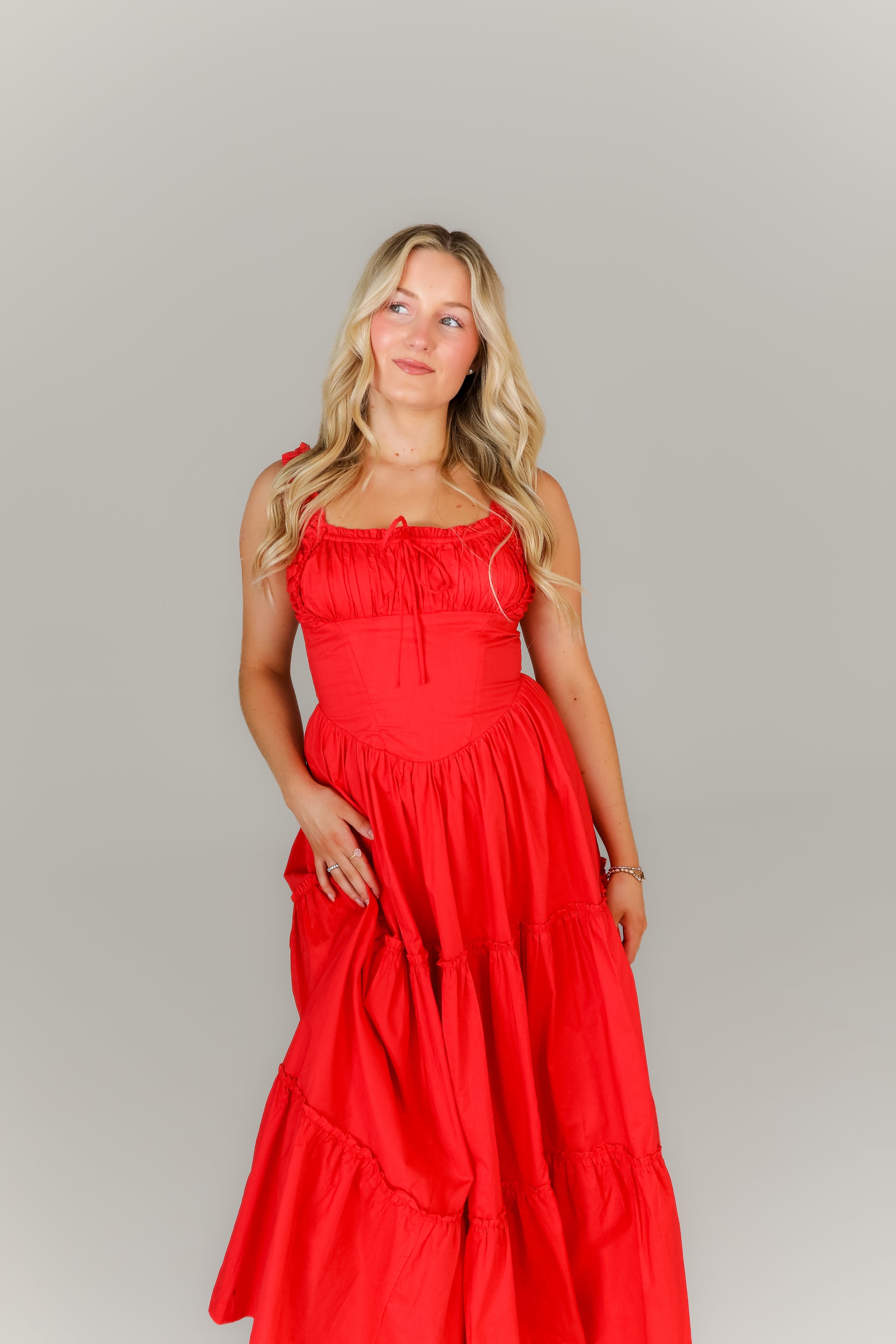 Front view of red smocked midi dress with square neckline