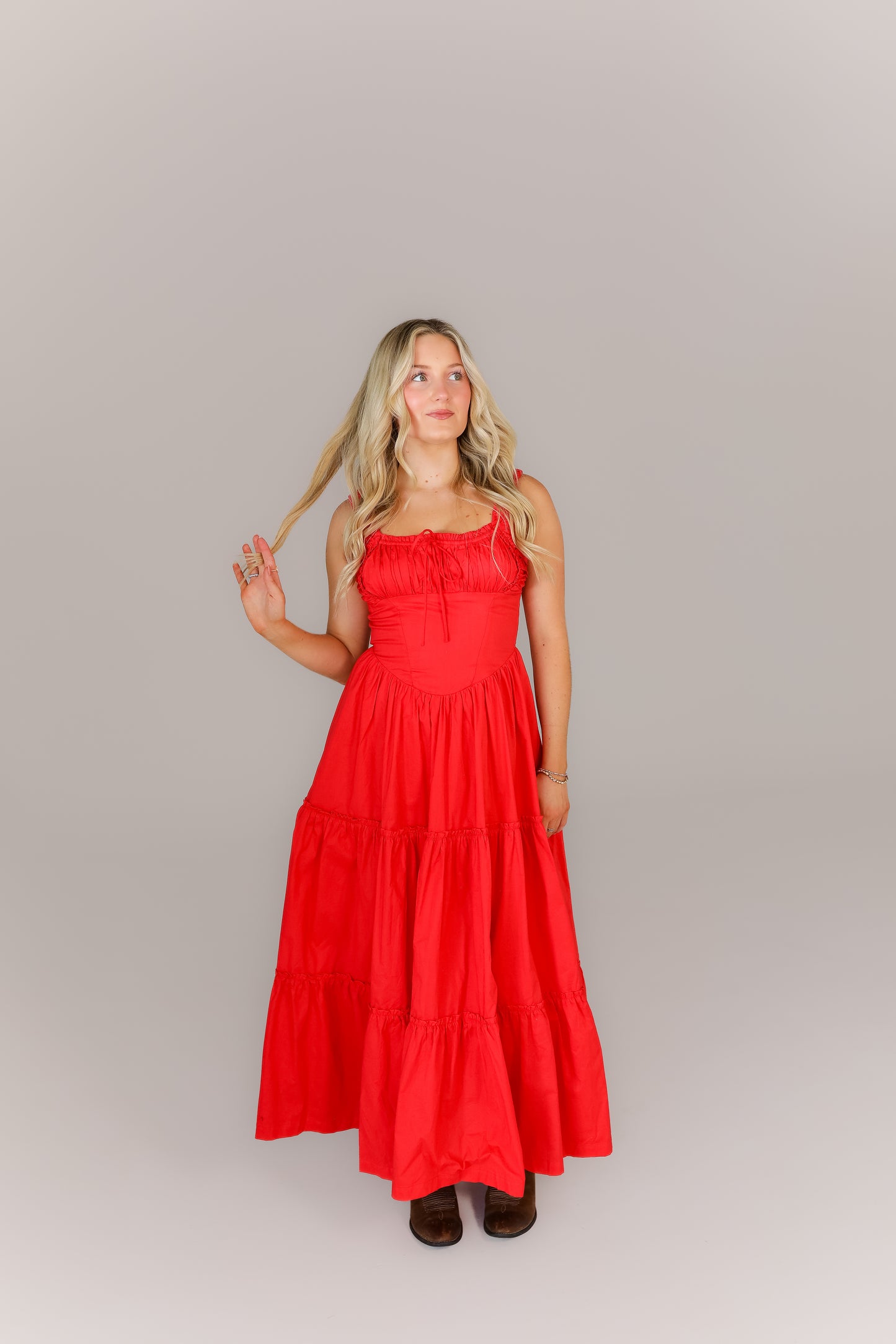 Bold red boutique dress styled for game day or weekend events