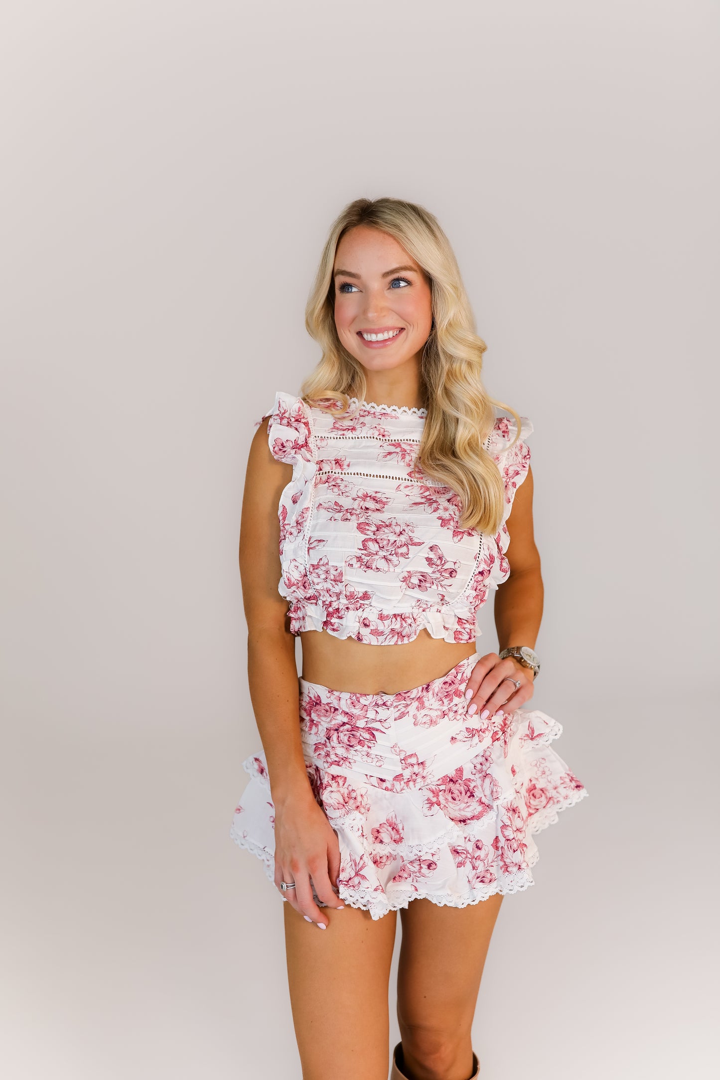 Model in burgundy floral two-piece set for sorority event outfit or gameday