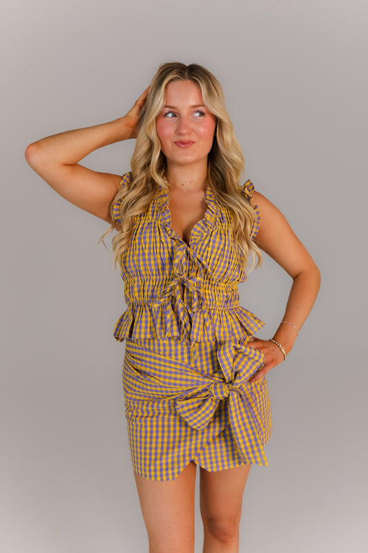 Victory Bow Set featuring sleeveless ruffle blouse and mini skirt