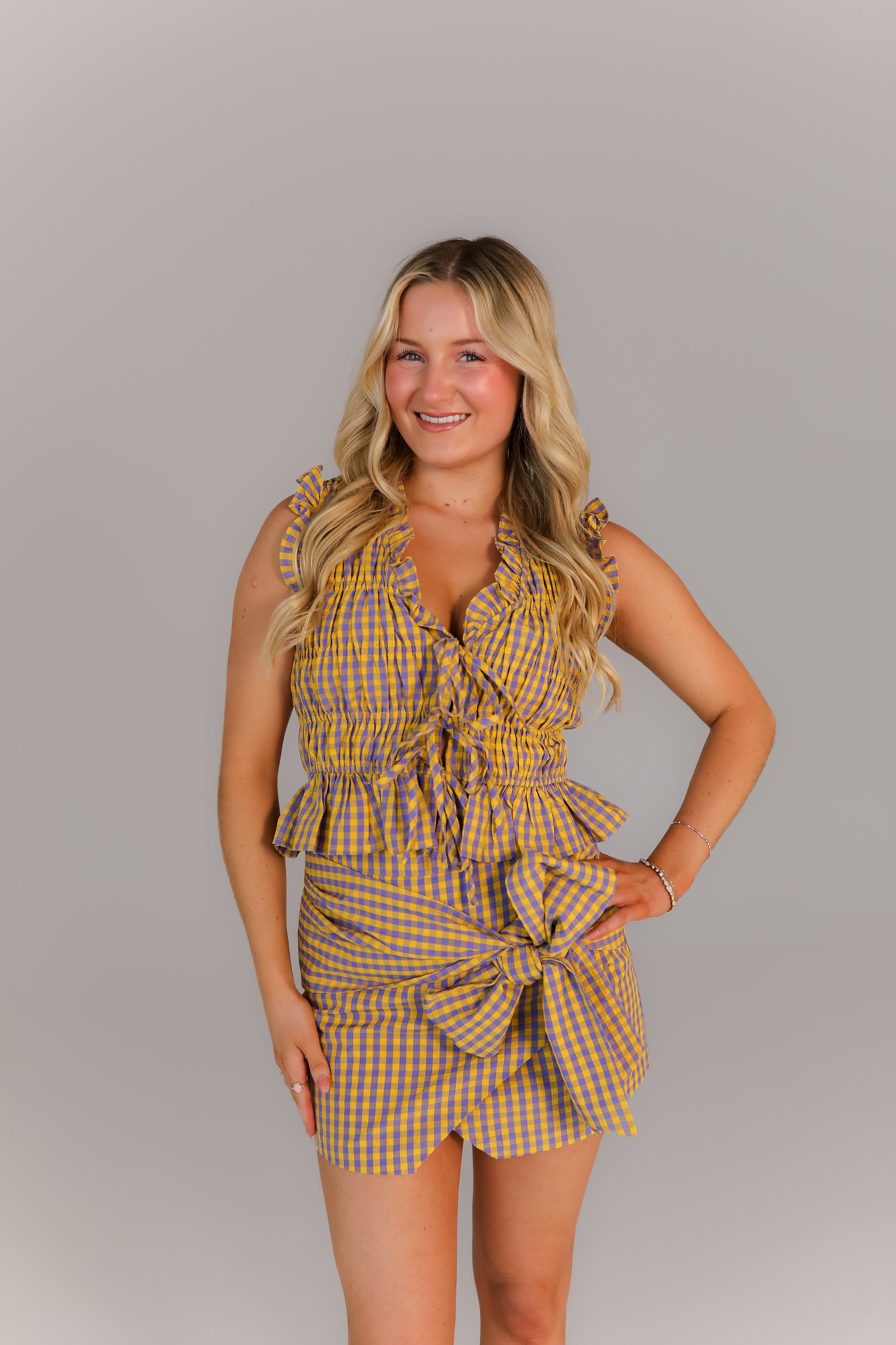 purple and yellow plaid boutique set with tie waist bow detail styled for game day