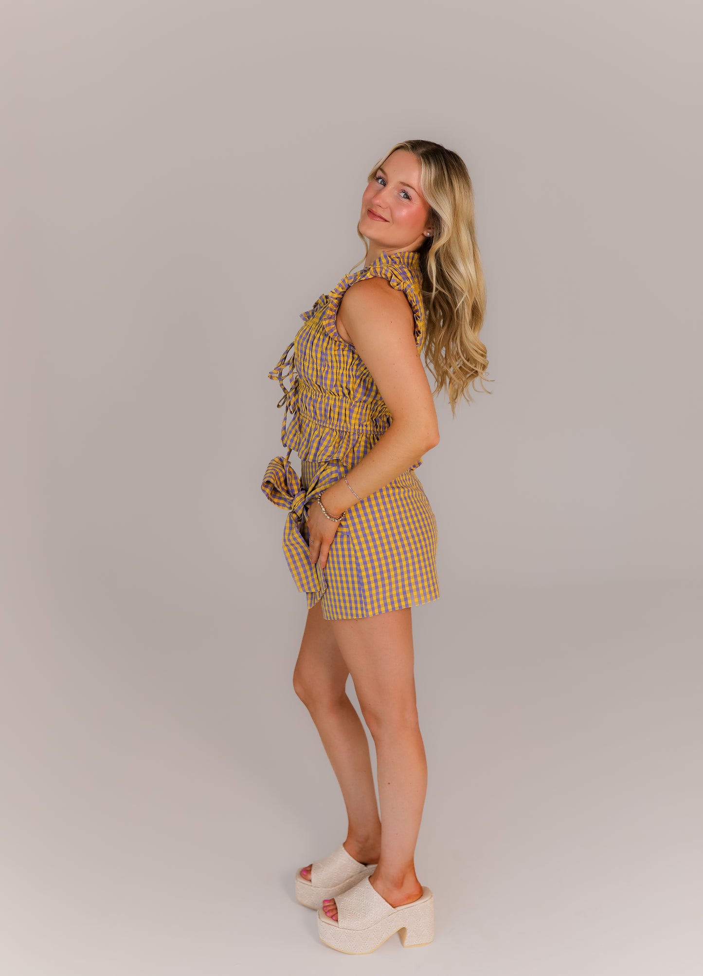 purple and yellow plaid boutique set with tie waist bow detail styled for game day