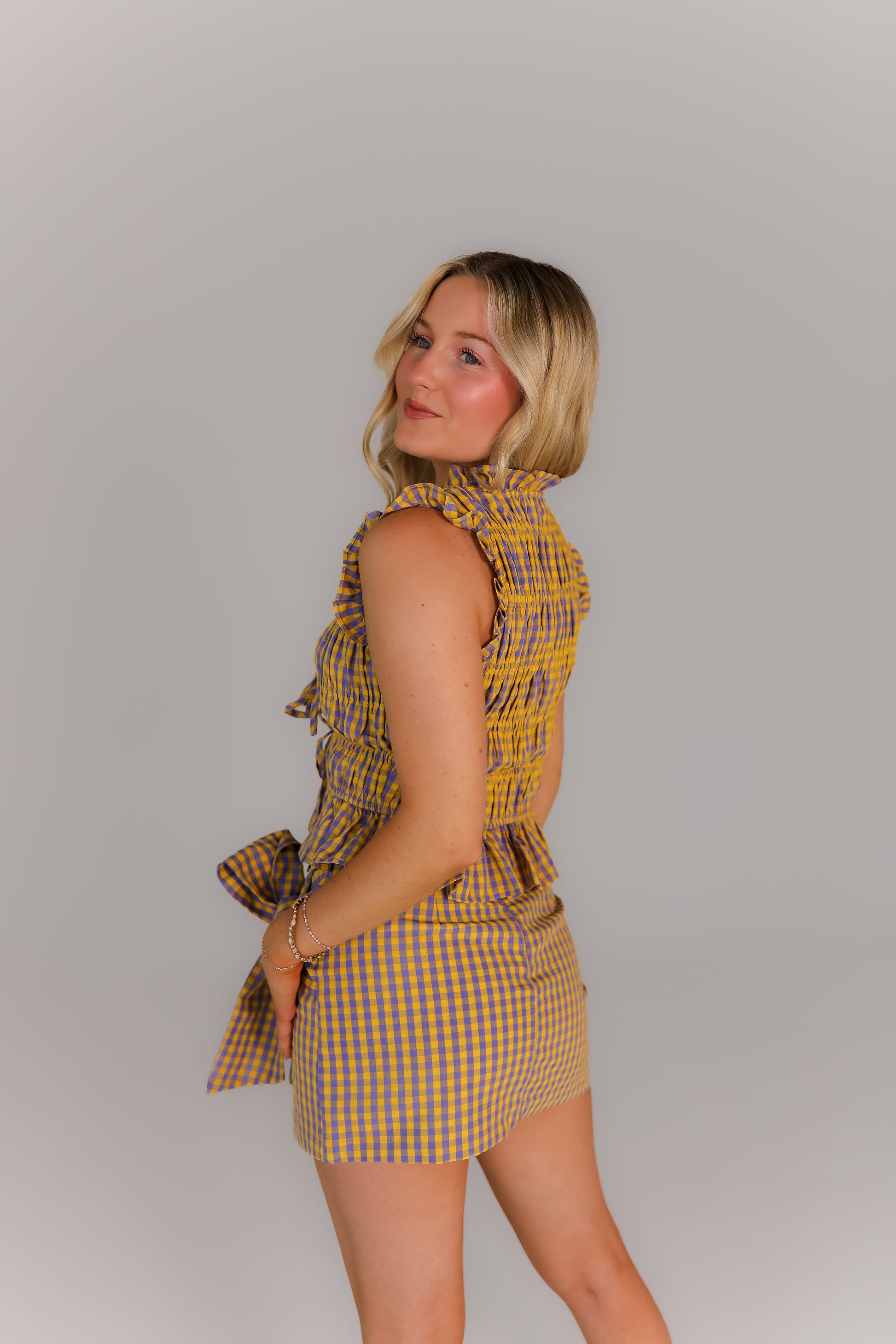 purple and yellow plaid boutique set with tie waist bow detail styled for game day